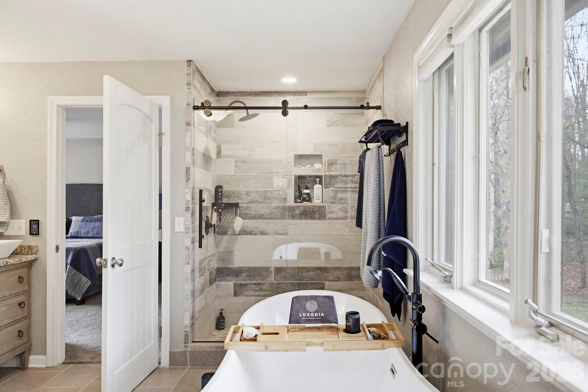27 Spring Hill Circle Arden, NC 28704 - Photo 23 of 47 a bathroom with a sink and a mirror