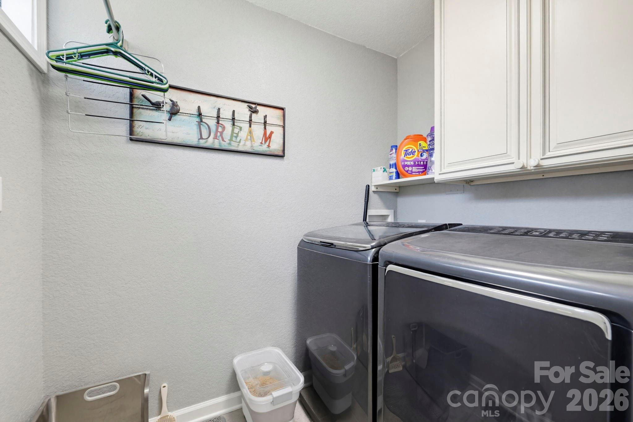 27 Spring Hill Circle Arden, NC 28704 - Photo 24 of 47 a utility room with dryer and washer