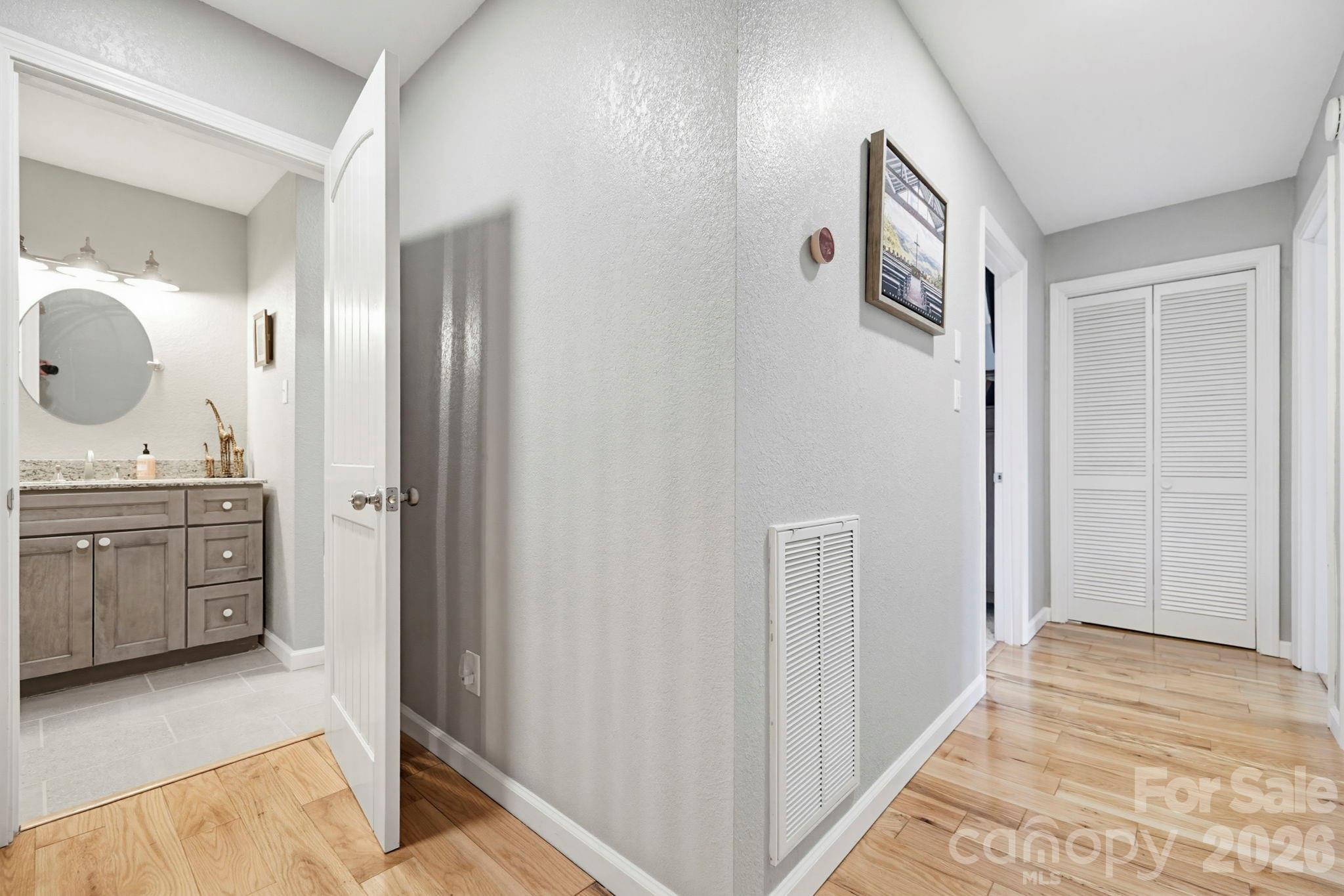 27 Spring Hill Circle Arden, NC 28704 - Photo 26 of 47 a spacious bathroom with a mirror and a sink