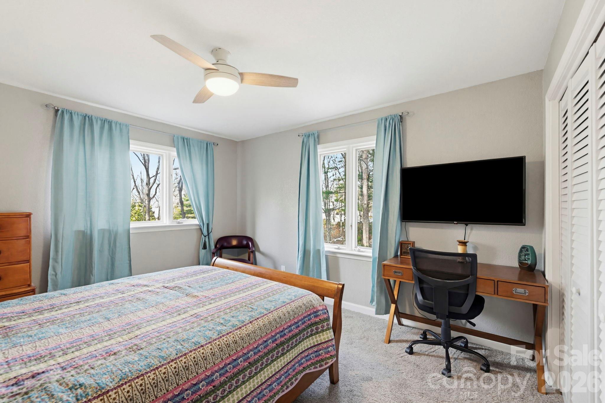 27 Spring Hill Circle Arden, NC 28704 - Photo 29 of 47 a bedroom with a workspace