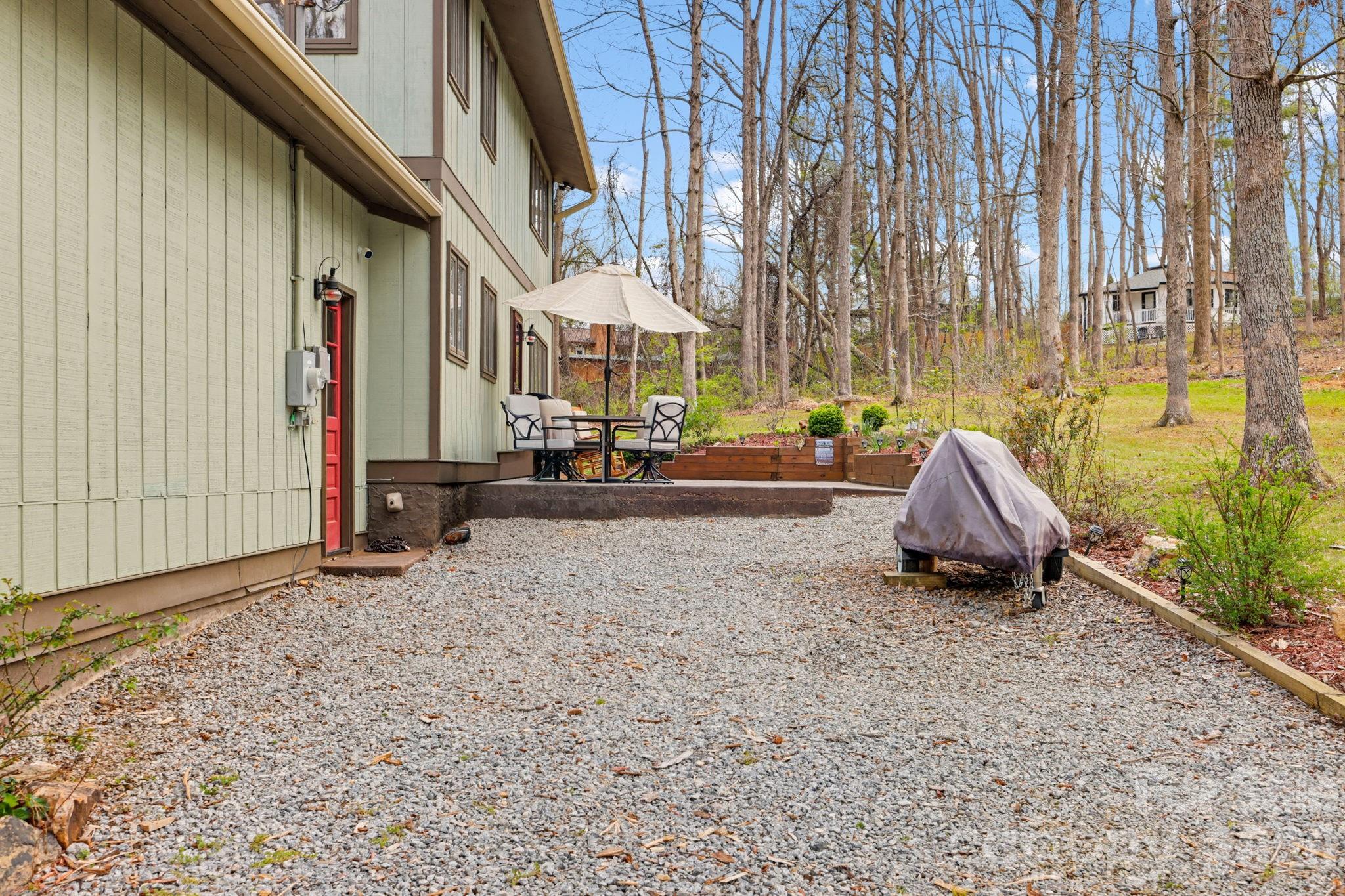 27 Spring Hill Circle Arden, NC 28704 - Photo 3 of 47 a view of the house with backyard and sitting area