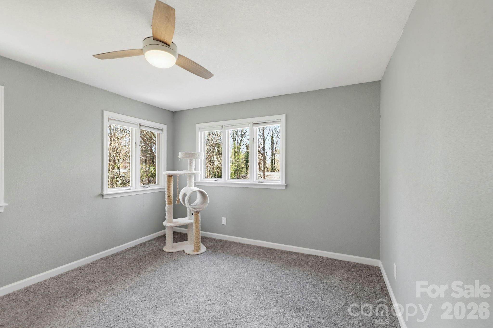 27 Spring Hill Circle Arden, NC 28704 - Photo 32 of 47 a view of a room with window and ceiling fan