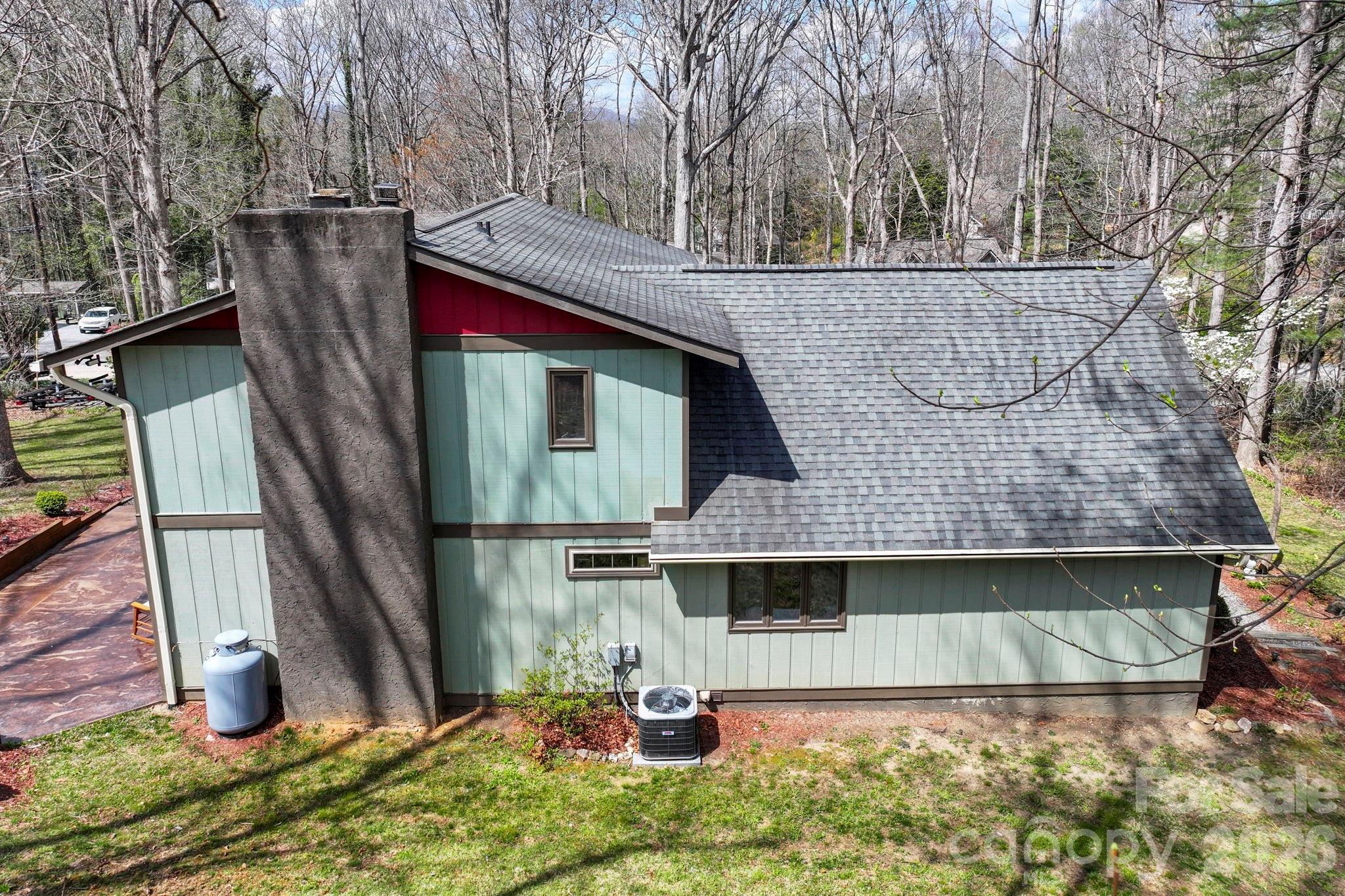 27 Spring Hill Circle Arden, NC 28704 - Photo 42 of 47 a backyard of a house with barbeque oven