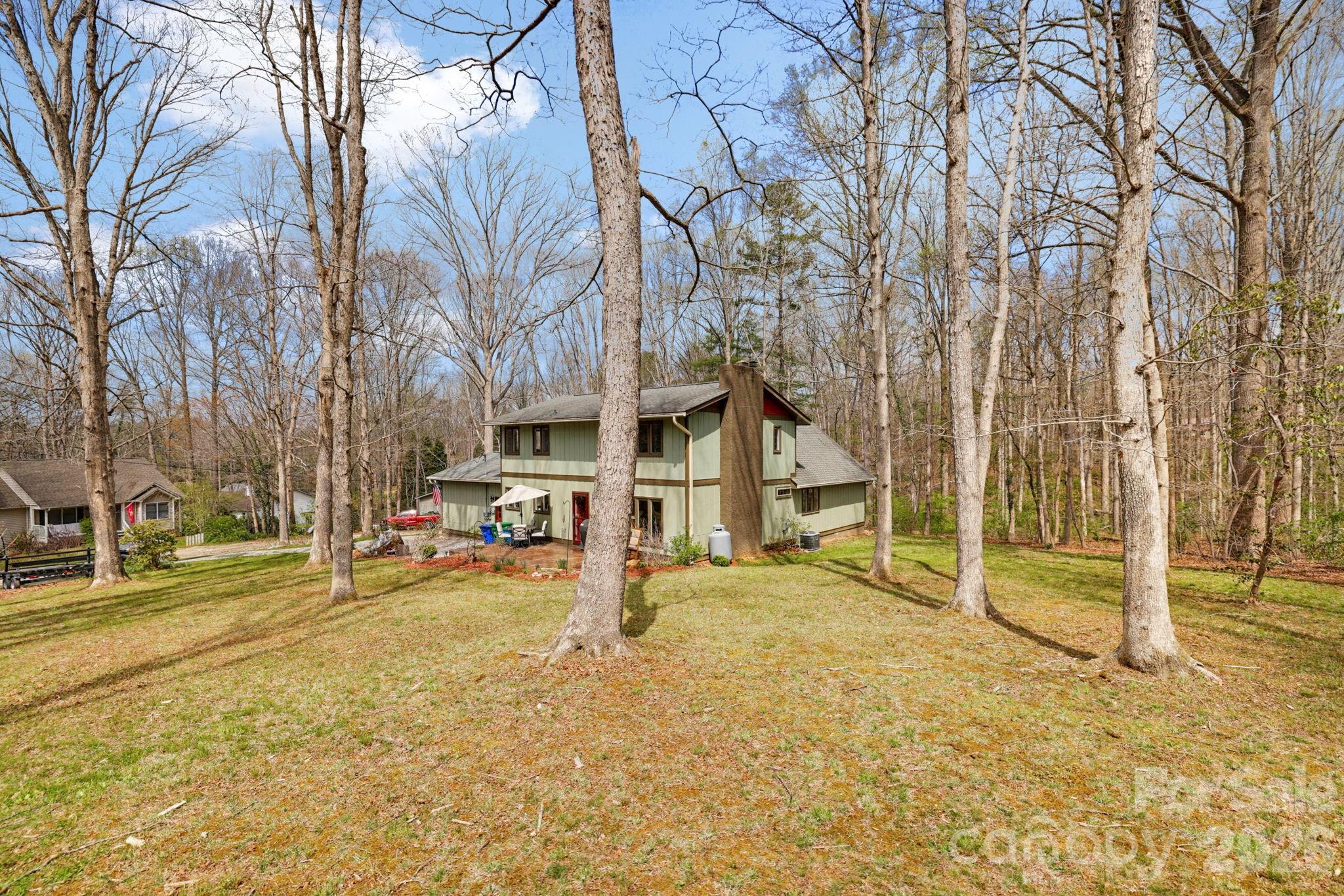 27 Spring Hill Circle Arden, NC 28704 - Photo 43 of 47 a view of a house with a yard and trees