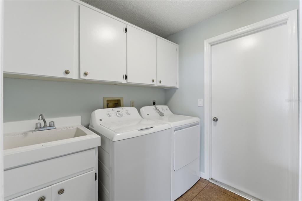 4966 Keysville Avenue Spring Hill, FL 34608 - Photo 31 of 48 a utility room with dryer and washer