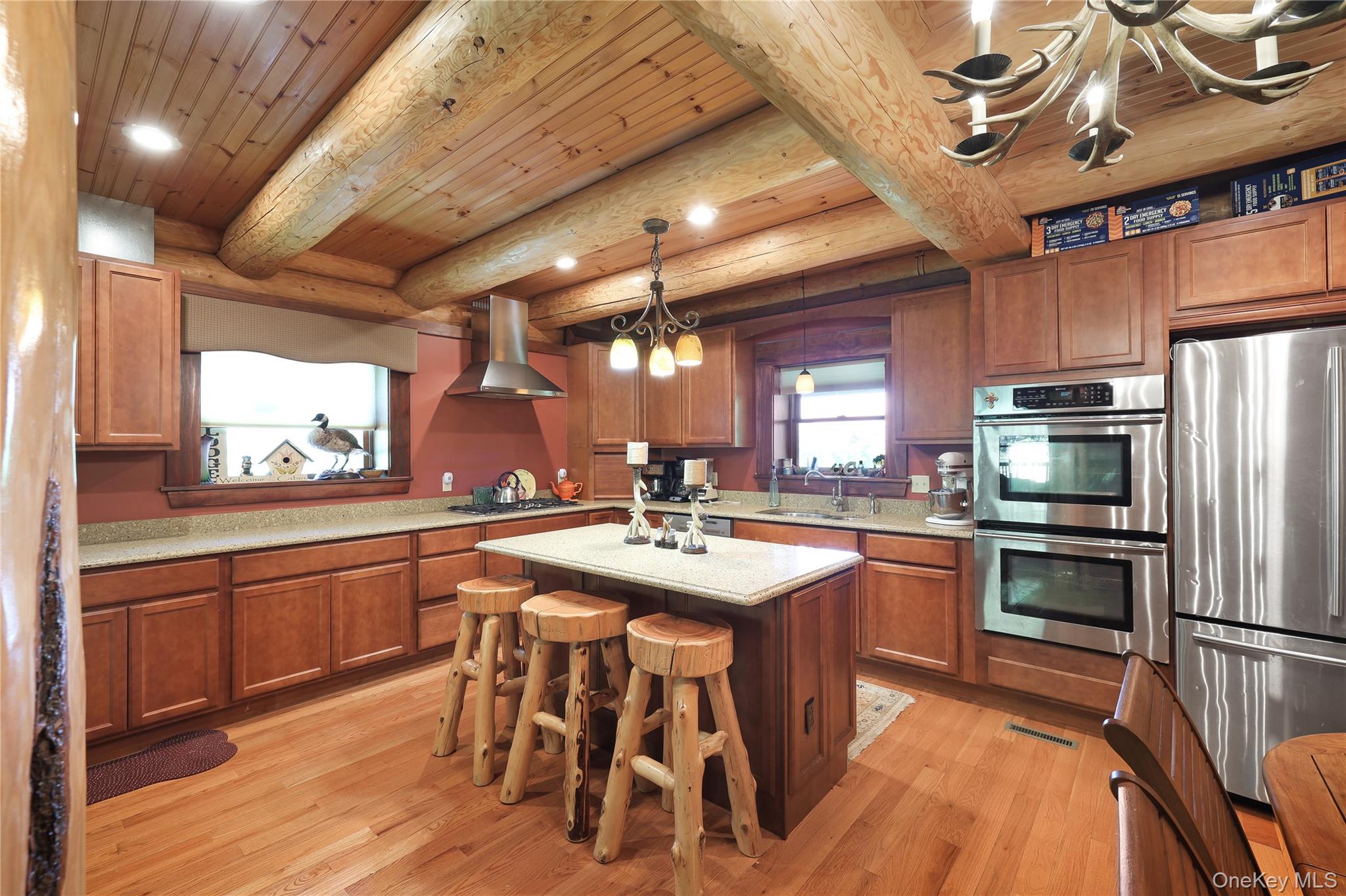 25 Cauthers Road Fallsburg, NY 12789 - Photo 9 of 27 a kitchen with stainless steel appliances granite countertop a sink a stove and a refrigerator