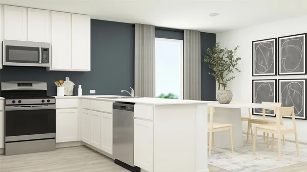 a kitchen with a white stove top oven and white cabinets