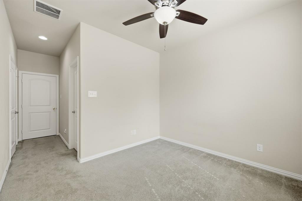 12809 Spring Hill Drive Frisco, TX 75035 - Photo 21 of 37 an empty room with a empty space and a ceiling fan
