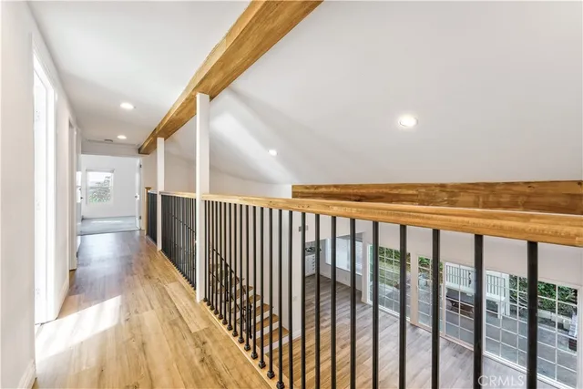 a view of a balcony with wooden floor