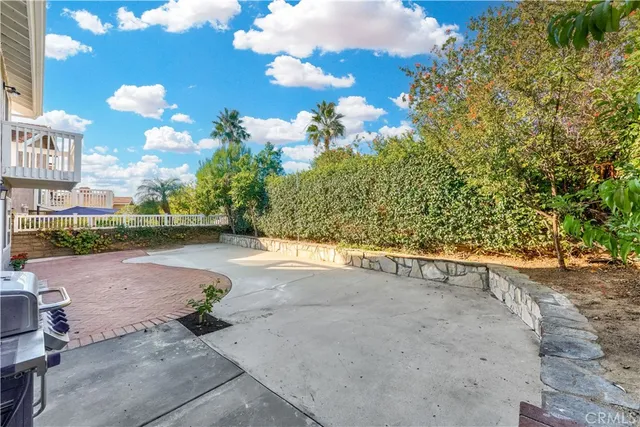 a view of a bench in the backyard