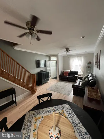 a living room with furniture and a rug