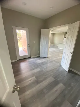 a view of balcony and floor to ceiling window