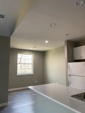 an empty room with wooden floor