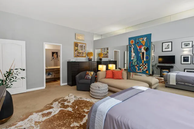 a bedroom with bed and furniture