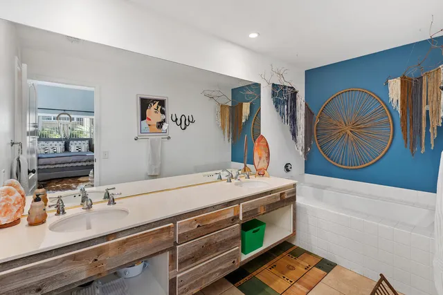 a bathroom with a sink double vanity and a mirror