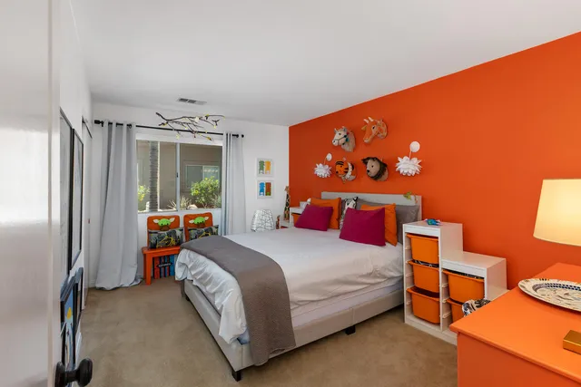 a bedroom with a bed and a closet