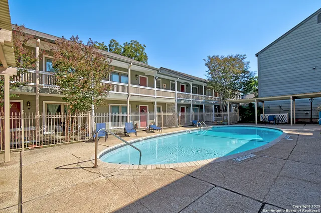 front view of a building with a garden