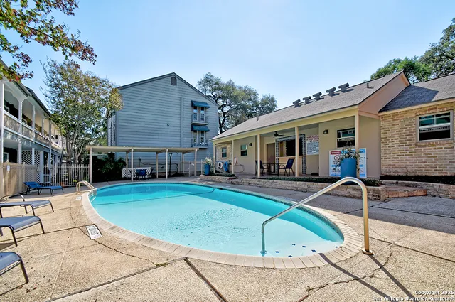 a front view of house with yard outdoor seating and barbeque oven