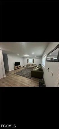 a view of kitchen island with wooden floor