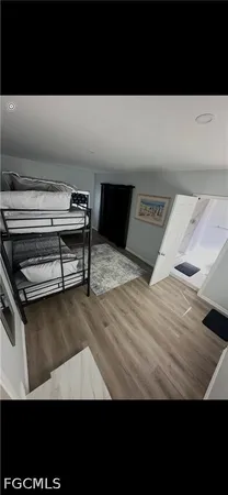 a view of a bedroom with furniture