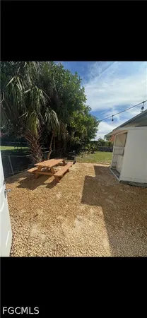 a view of a backyard of the house