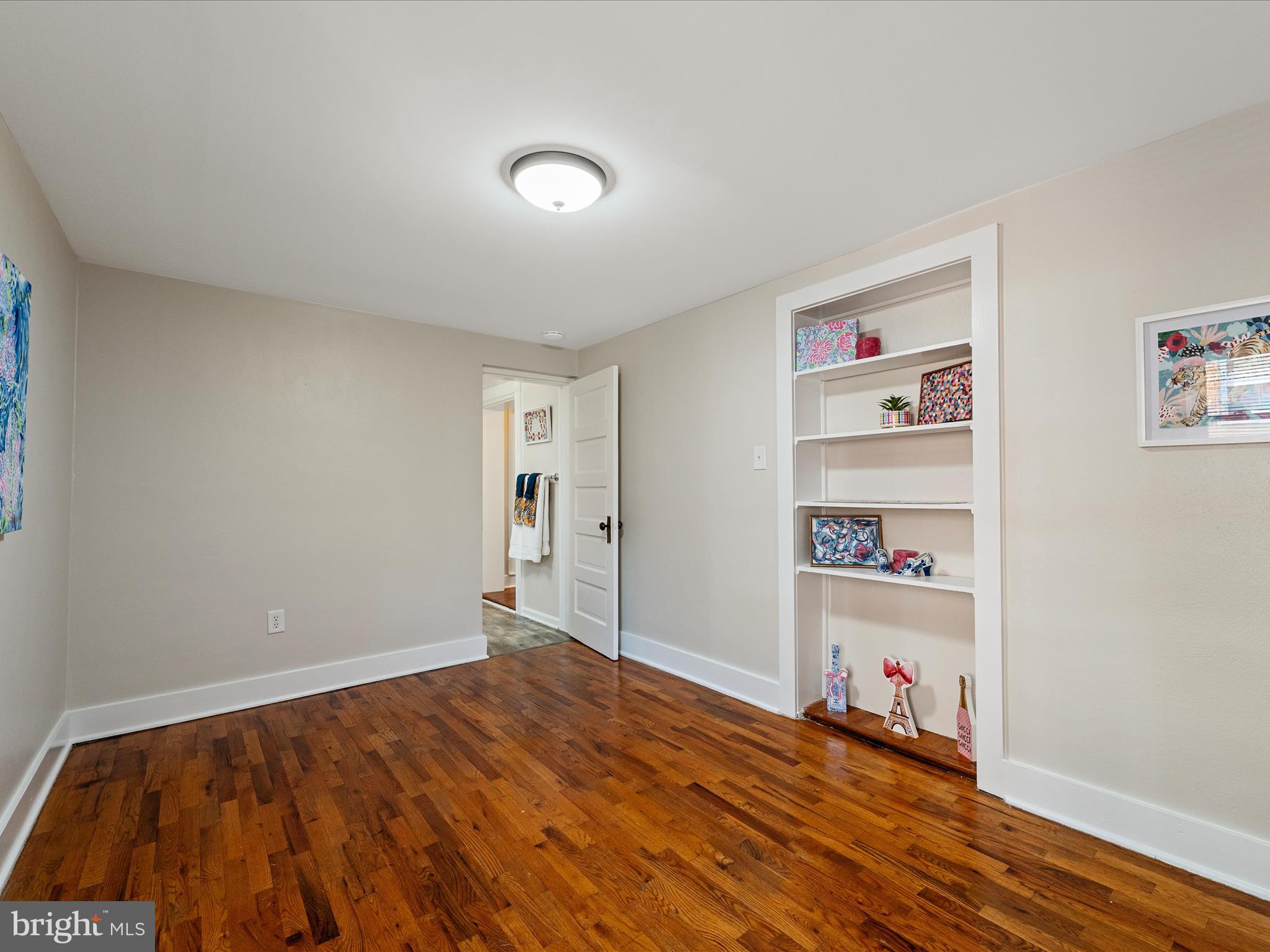 321 North Braddock Street Winchester, VA 22601 - Photo 18 of 23 a bedroom with a bed and a book shelf
