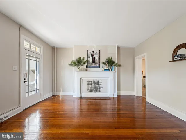 a view of kitchen with furniture and wooden floor