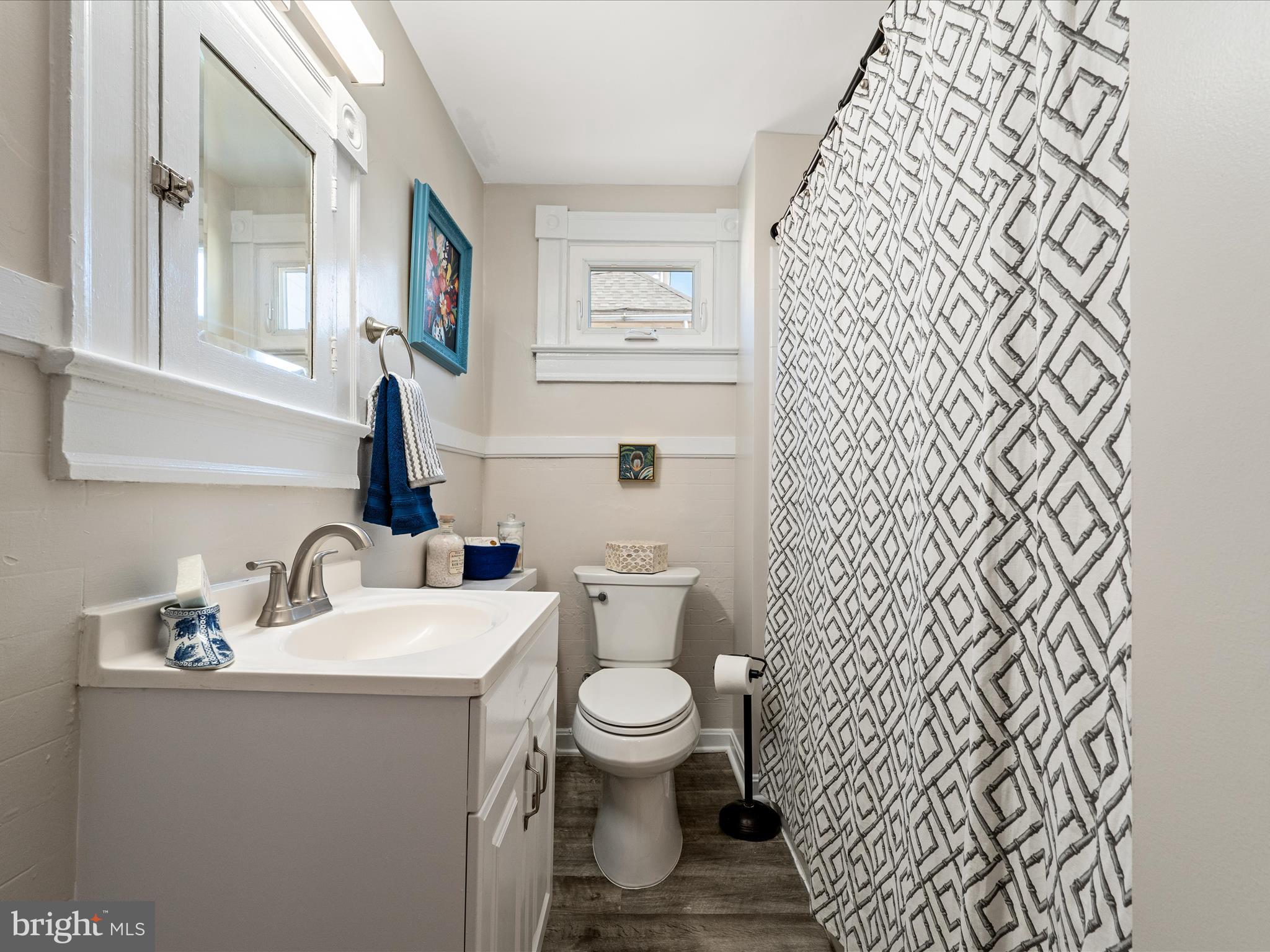 321 North Braddock Street Winchester, VA 22601 - Photo 21 of 23 a bathroom with a toilet a sink and a mirror