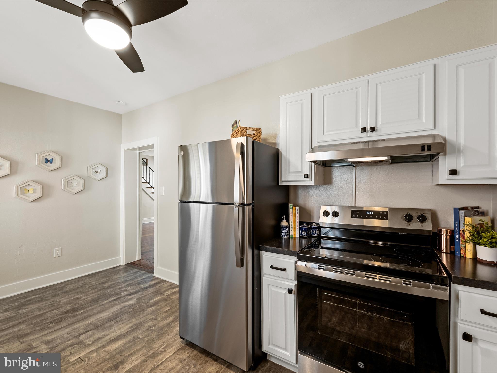 321 North Braddock Street Winchester, VA 22601 - Photo 10 of 23 a kitchen with a stove and a refrigerator