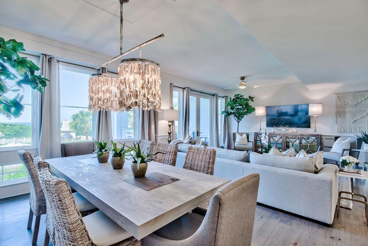 337 Bridge Lane, Unit 102B Inlet Beach, FL 32461 - Photo 13 of 50 a dining room with furniture a chandelier and window