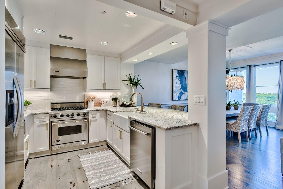 337 Bridge Lane, Unit 102B Inlet Beach, FL 32461 - Photo 16 of 50 a kitchen with a stove a sink and a refrigerator