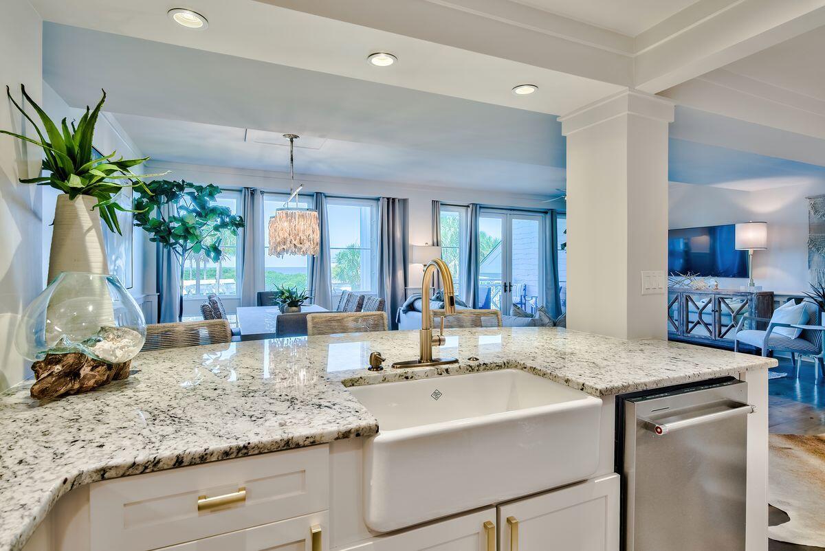 337 Bridge Lane, Unit 102B Inlet Beach, FL 32461 - Photo 17 of 50 a bathroom with a granite countertop sink a large mirror and a window