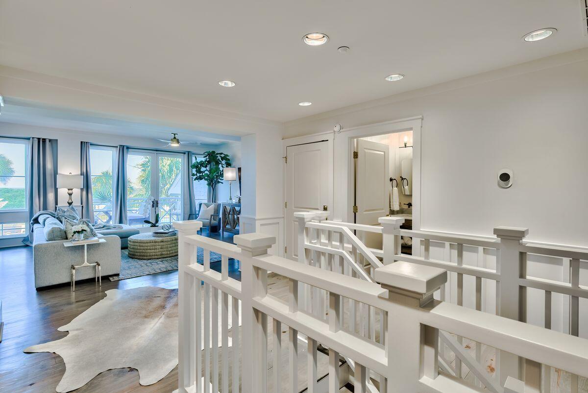 337 Bridge Lane, Unit 102B Inlet Beach, FL 32461 - Photo 18 of 50 a large room with lots of white furniture