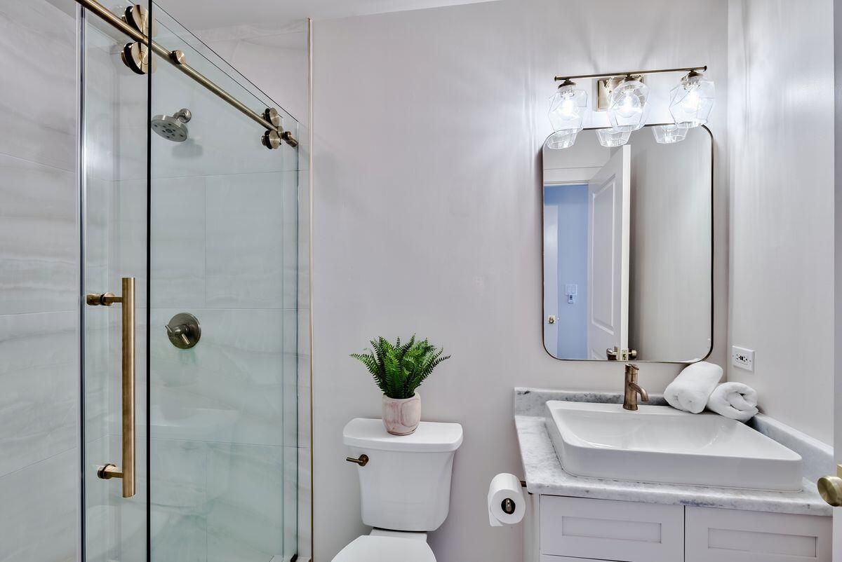 337 Bridge Lane, Unit 102B Inlet Beach, FL 32461 - Photo 26 of 50 a bathroom with a toilet sink and shower