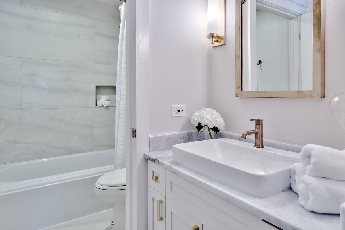 337 Bridge Lane, Unit 102B Inlet Beach, FL 32461 - Photo 29 of 50 a bathroom with a sink toilet and shower