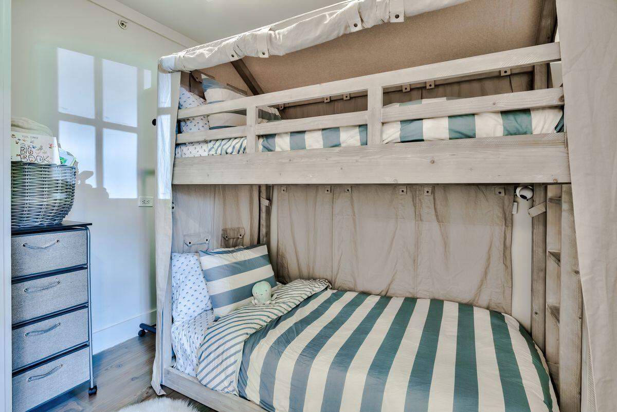 337 Bridge Lane, Unit 102B Inlet Beach, FL 32461 - Photo 30 of 50 a bedroom with a bed and a dresser