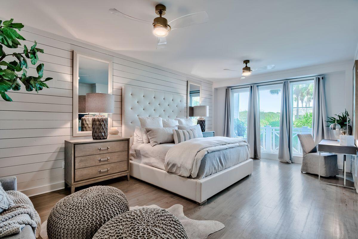337 Bridge Lane, Unit 102B Inlet Beach, FL 32461 - Photo 32 of 50 a bed room with a bed and a couch