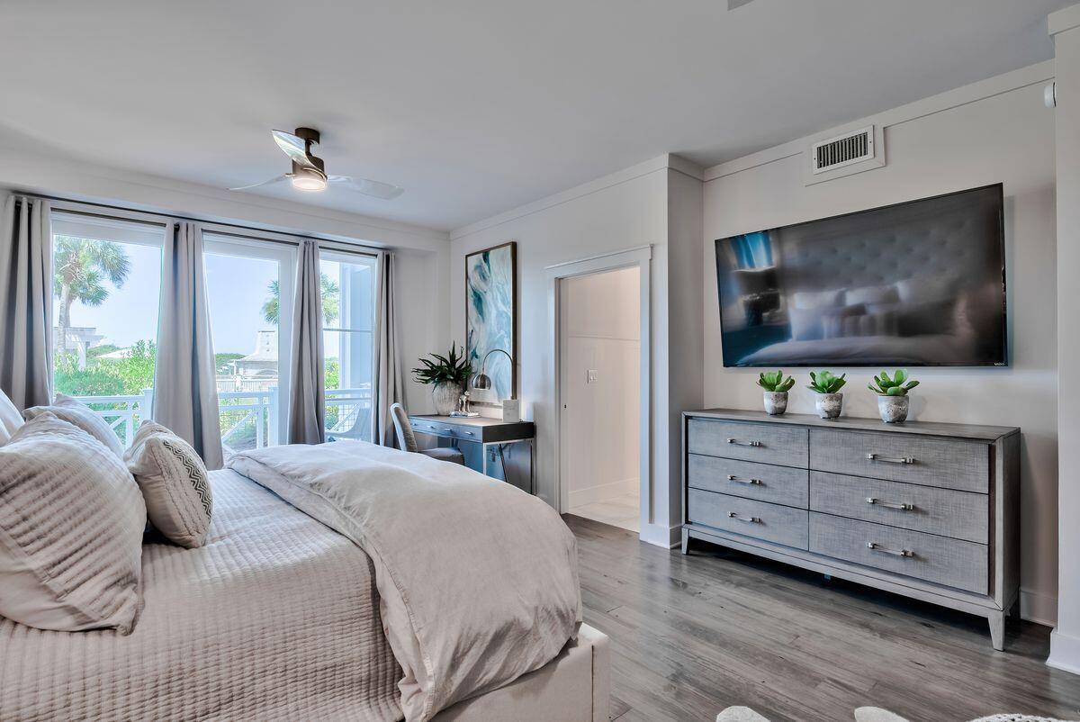337 Bridge Lane, Unit 102B Inlet Beach, FL 32461 - Photo 33 of 50 a bedroom with a bed and a flat screen tv