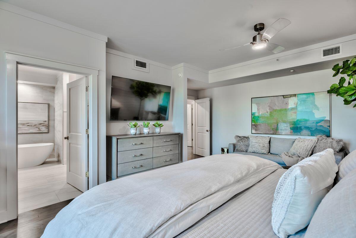 337 Bridge Lane, Unit 102B Inlet Beach, FL 32461 - Photo 34 of 50 a bedroom with a bed and a flat screen tv