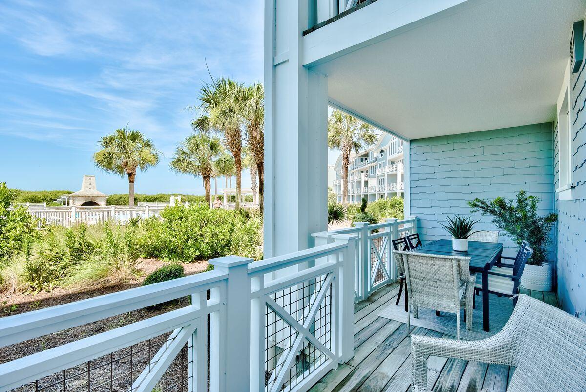 337 Bridge Lane, Unit 102B Inlet Beach, FL 32461 - Photo 38 of 50 a view of a chairs and table in the balcony