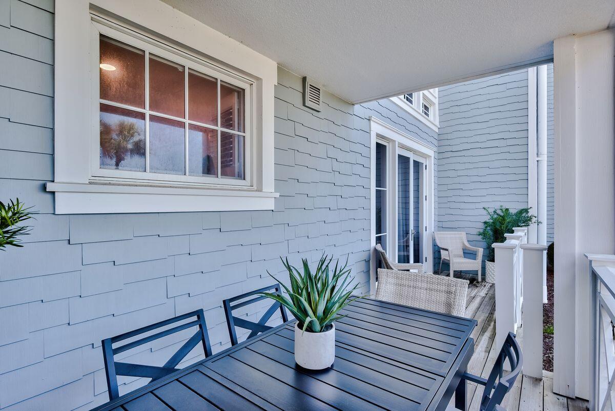 337 Bridge Lane, Unit 102B Inlet Beach, FL 32461 - Photo 39 of 50 a potted plant sitting on a wooden bench