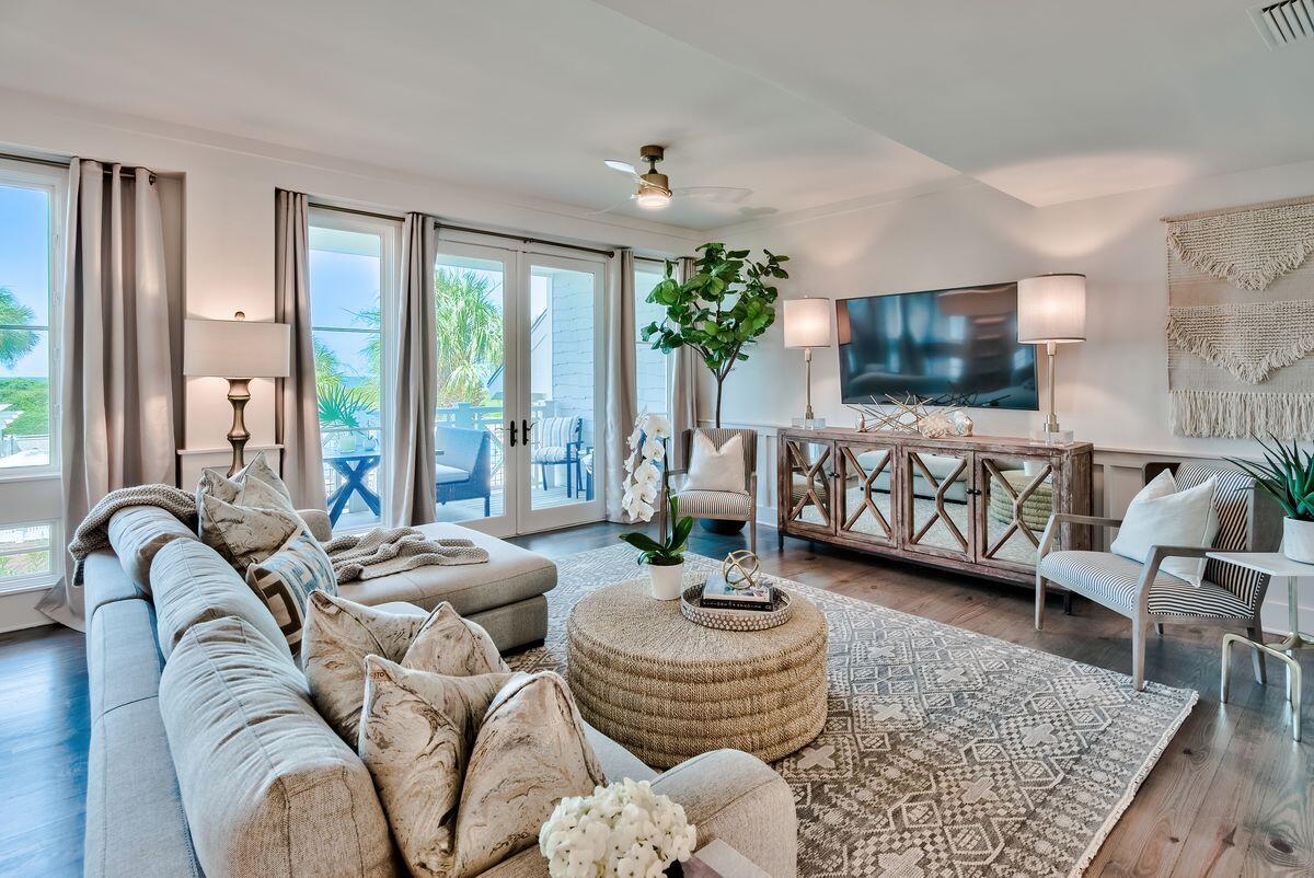 337 Bridge Lane, Unit 102B Inlet Beach, FL 32461 - Photo 4 of 50 a living room with furniture and a flat screen tv