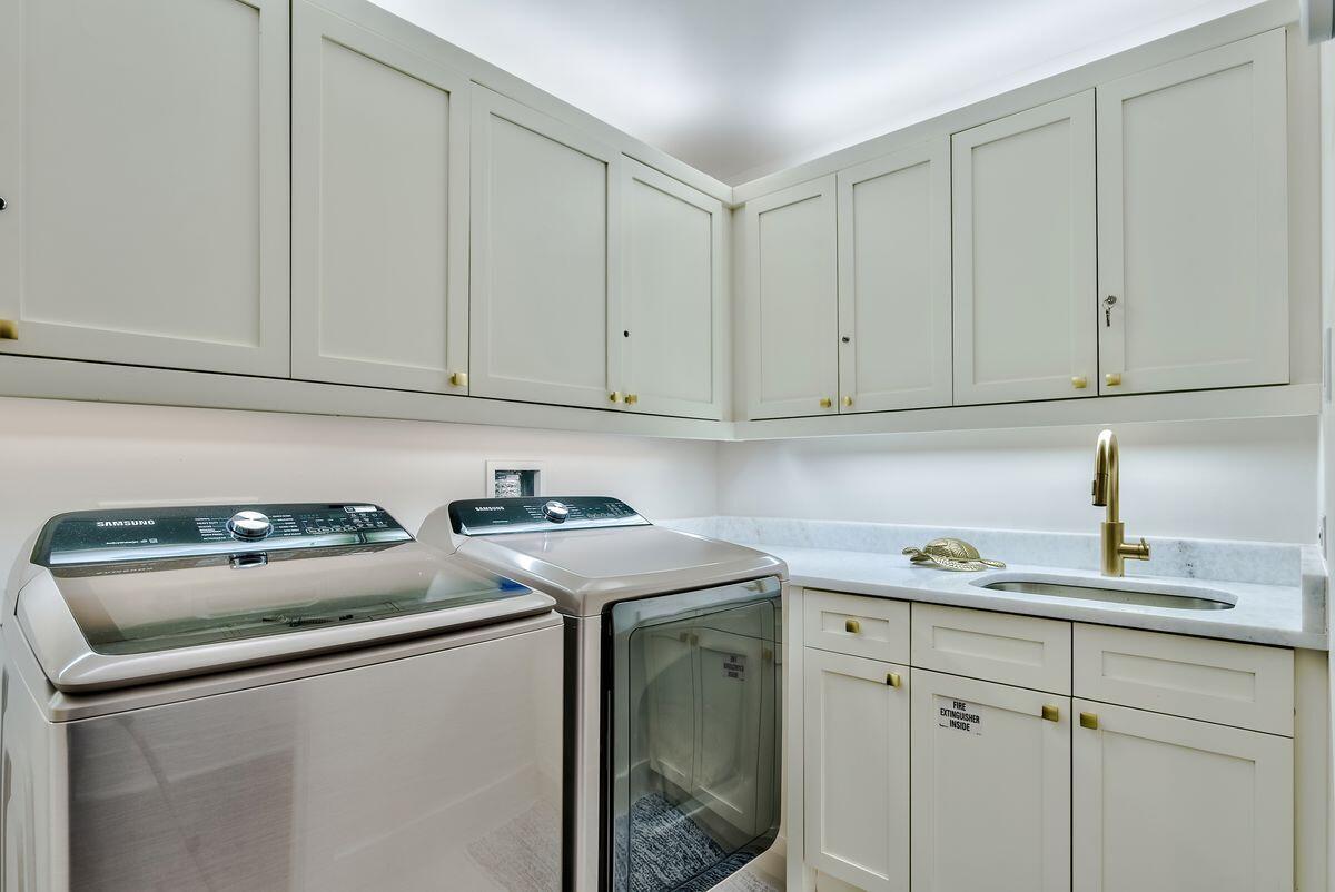 337 Bridge Lane, Unit 102B Inlet Beach, FL 32461 - Photo 41 of 50 a utility room with sink dryer and cabinets