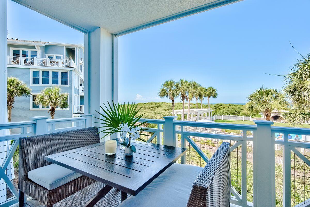 337 Bridge Lane, Unit 102B Inlet Beach, FL 32461 - Photo 6 of 50 a view of a dining room with furniture a potted plant and wooden floor