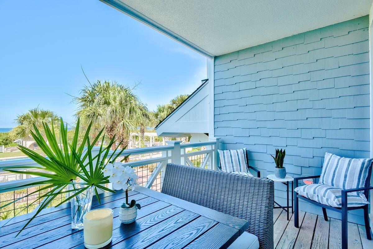 337 Bridge Lane, Unit 102B Inlet Beach, FL 32461 - Photo 7 of 50 a view of balcony with wooden floor and seating space