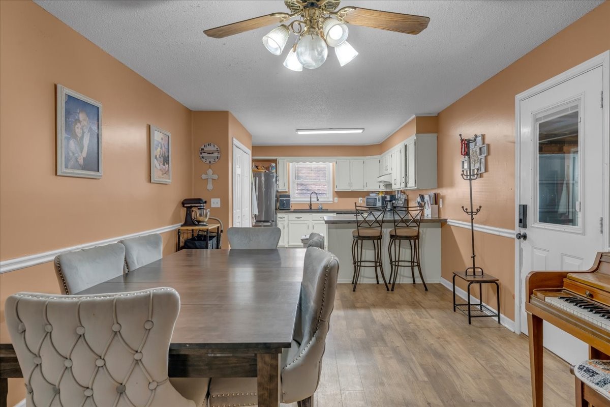 202 Mortons Lake Road Manchester, TN 37355 - Photo 13 of 41 a living room with couches and kitchen view with wooden floor