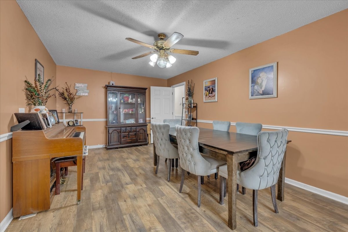 202 Mortons Lake Road Manchester, TN 37355 - Photo 14 of 41 a view of a dining room with furniture and wooden floor