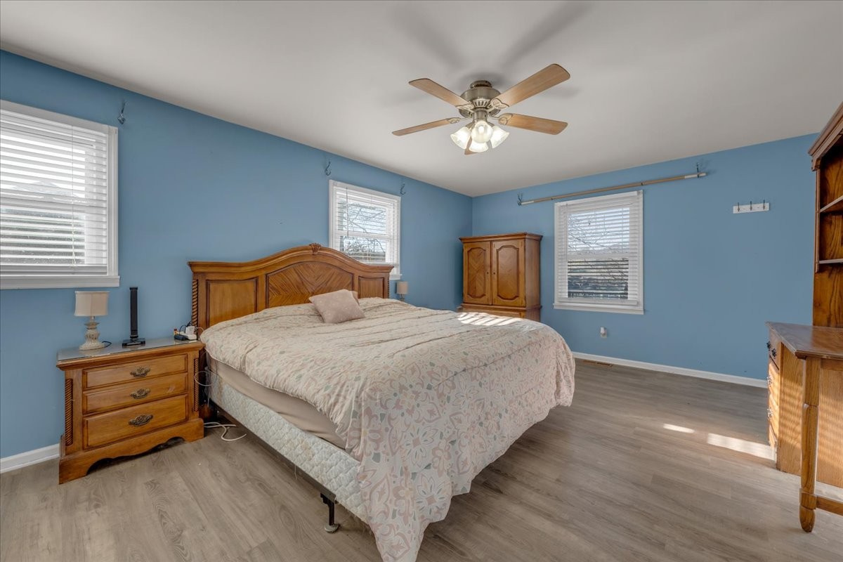 202 Mortons Lake Road Manchester, TN 37355 - Photo 26 of 41 a bedroom with a bed and a chandelier