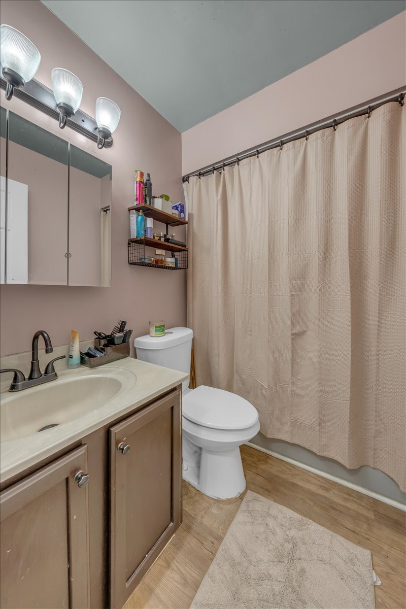 202 Mortons Lake Road Manchester, TN 37355 - Photo 30 of 41 a bathroom with a sink a toilet and shower curtain