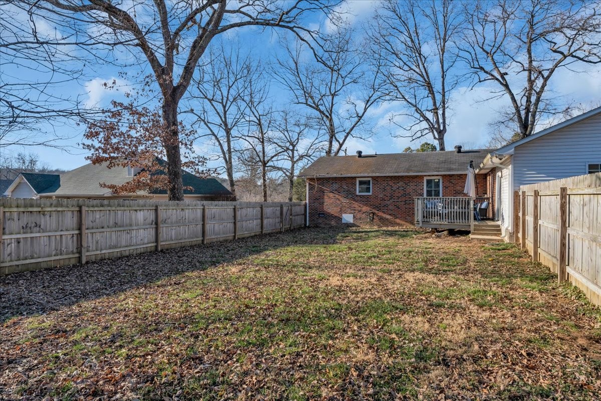 202 Mortons Lake Road Manchester, TN 37355 - Photo 38 of 41 a view of a house with a large tree and wooden fence